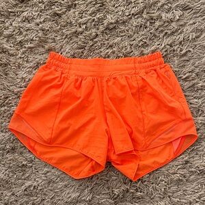 lululemon Neon Orange Hotty Hot Low Rise 4”